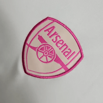 Maillot d'entraînement blanc et rose d'Arsenal 2023/24